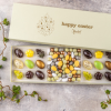 Golden eggs spring 18 mix, 18 fyldte chokolader. lakrids, yuzu, flødekaramel,mint, citron, saltkaramel, marcipan og nougat. Dragemix og mere. Ca. 400 gr.