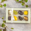 Xocolatl spring feeling 8, fyldte chokolader, smagsvarianter som lakrids, yuzu,marcipan, flødekaramel, mint, citrusmix, saltkaramel og nougat Ca. 94 gr.