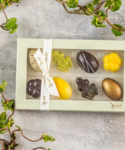 Xocolatl spring feeling 8, fyldte chokolader, smagsvarianter som lakrids, yuzu,marcipan, flødekaramel, mint, citrusmix, saltkaramel og nougat Ca. 94 gr.